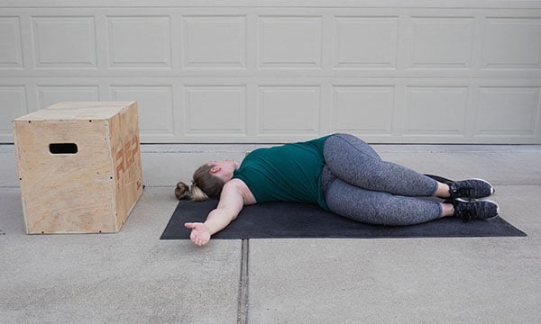 woman stretching for postpartum posture